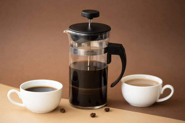 istock black coffee and coffee with milk in small cups on brown background 1285741719