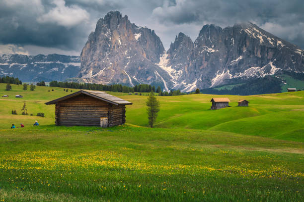 istock Seiser Alm resort with snowy mountains in background, Dolomites, Italy 1285742765