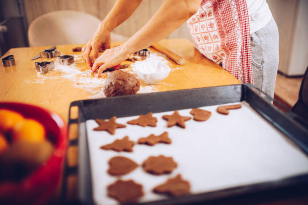 istock Mature woman preparing gingerbread cookies 1285745560