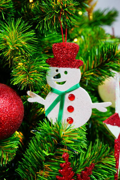 istock Snowman hanging on Christmas tree decoration. 1285745604