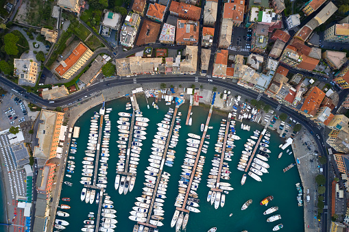 Top view on a harbor with moored sea ships, yachts and sailboats in Ligurian Sea. Santa Margherita Ligure is an italian riviera near Portofino and Genoa