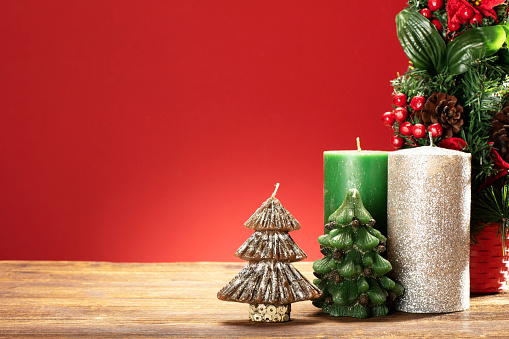 Handmade Fir Tree and Pine Cone Shaped Candles on the Table in the Shop. Winter Holidays Decoration