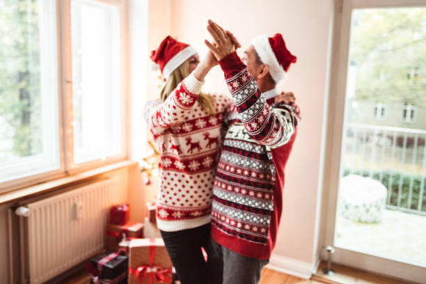 istock couple dancing at home for christmas 1285749129