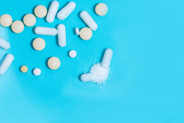 istock close up. capsules with medicine and tablets on the table 1285750196