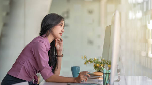 istock Businesswoman frustrated by business problem and feeling unwell suffering from work stress sitting at the office desk. 1285750355