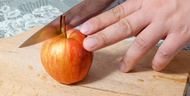 istock close-up cutting an apple with a knife 1285753634