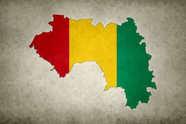Photo of Grunge map of Guinea with its flag printed within