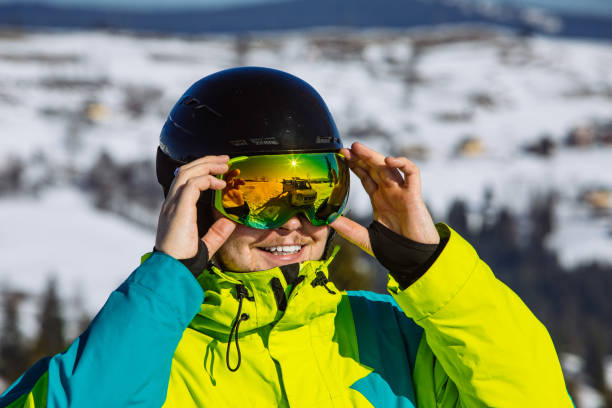 istock man in helmet and ski mask. reflection. winter activity 1285759639