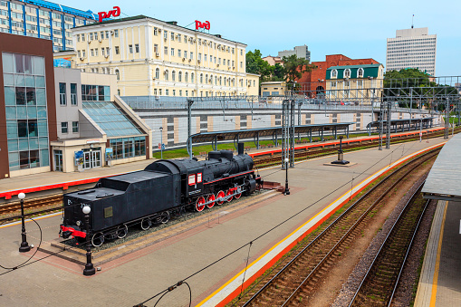 Vladivostok, Russia - July 30, 2015: An old steam locomotive stands on the platform of Vladivostok Railroad Station, Trans-Siberian Railway.
