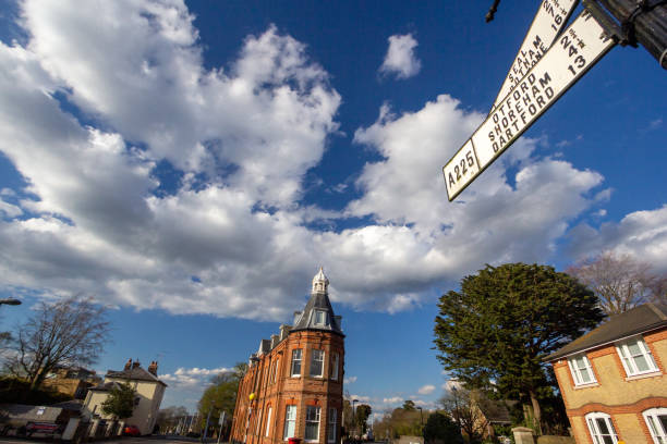 Built in 1889, this building was known as the Constitutional Club and was used for social and political meetings. In February 1950, Winston Churchill made an election speech from here. It has also been used as offices by lawyers and more recently was converted into luxury apartments including penthouses. A road sign points to Otford, Shoreham and Dartford.