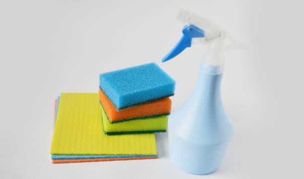 istock Cleaning set for different surfaces in kitchen, bathroom and other rooms. spray bottle with Shape Sponge and kitchen rags. flat lay, Cleaning service concept. 1285763398
