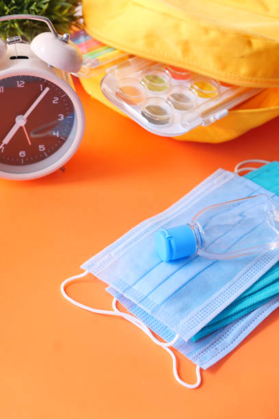 istock Student school bag pack with sanitizer, a face mask. 1285764333