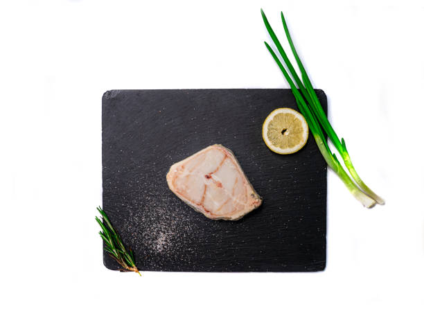 raw catfish steak on shale board with rosemary, green onion and lemon - green steak food gourmet imagens e fotografias de stock