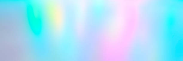 istock Blurred colorful multicolored background from lights. Iridescent holographic abstract bright neon colors backdrop. banner 1285765620