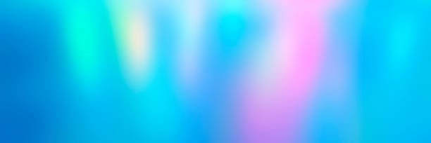 istock Blurred colorful multicolored background from lights. Iridescent holographic abstract bright neon colors backdrop. banner 1285765633