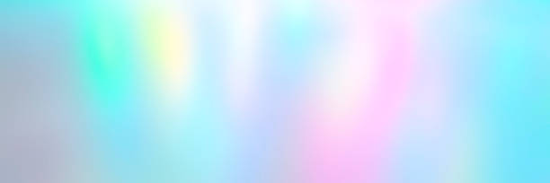 istock Blurred pastel multicolored background from lights. Iridescent holographic abstract aurora light neon colors backdrop. banner 1285765662