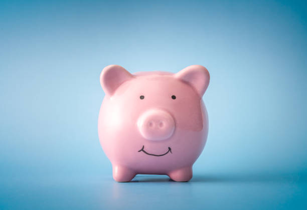 Piggy bank over blue background stock photo
