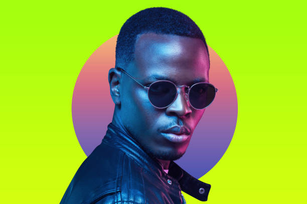 African american cyberpunk portrait, wearing retro sunglasses and leather jacket, isolated on neon green background African american cyberpunk portrait, wearing retro sunglasses and leather jacket, isolated on neon green background fashion model men male sunglasses stock pictures, royalty-free photos & images