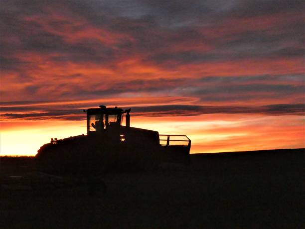 Evening mood in the country with agricultural machinery