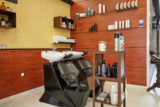 istock Shampoo Sinks and Chairs in Modern Hair Salon 1285770454