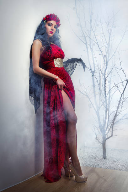 istock Witch in a red dress 1285772615