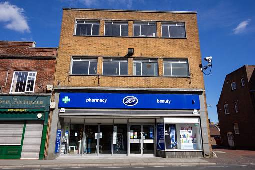 This Sevenoaks branch Boots Opticians is part of the wider Boots Group which is a subsidiary of Walgreens Boots Alliance. Other stores can be seen on either side.