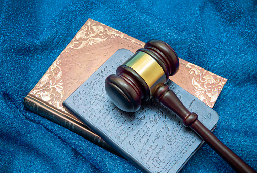 Gavel and Law Book on textile background