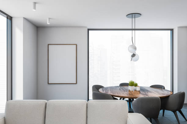 istock Modern white dining room interior with poster and sofa 1285774448