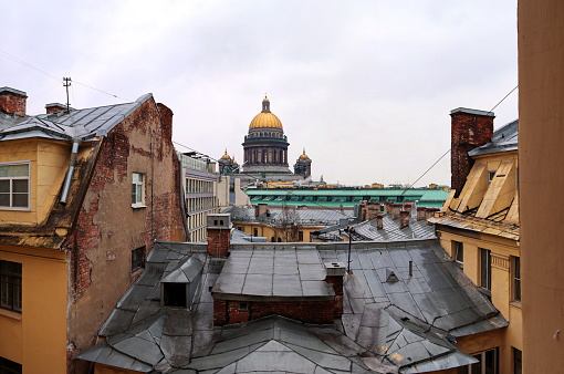 view of the rooftops of the old city with the dome of the cathedral on the background.