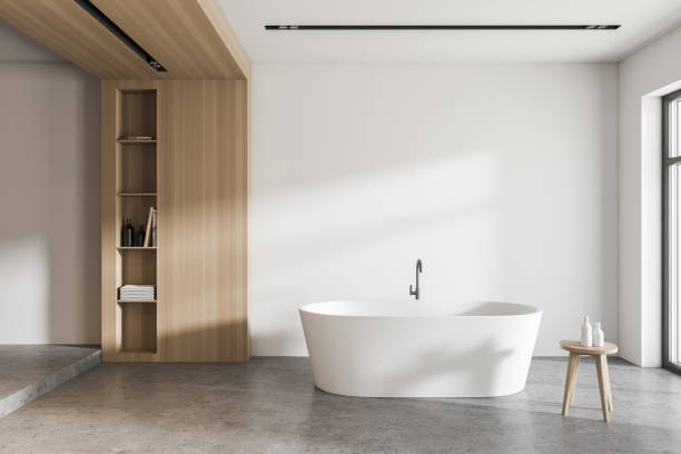 istock Modern white and wooden bathroom with tub 1285775312