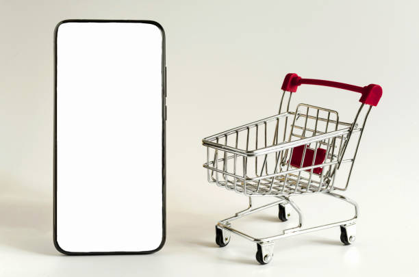 istock red empty cart and smartphone with a white screen on a light background online trading concept 1285779196