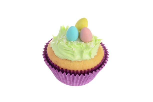 istock isolated easter cupcake with coconut frosting and mini chocolate eggs 1285783129