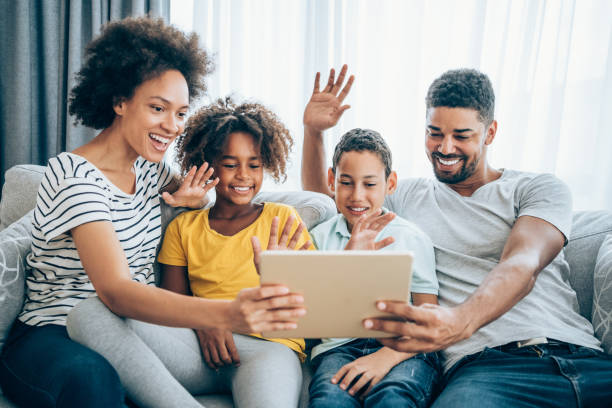 istock Family using digital tablet to make a video call. 1285783770