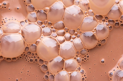 Bubbles floating on the surface of chocolate milk