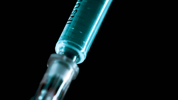 istock A surgical syringe injects the virus. Infected blood. Macro frame 1285784987