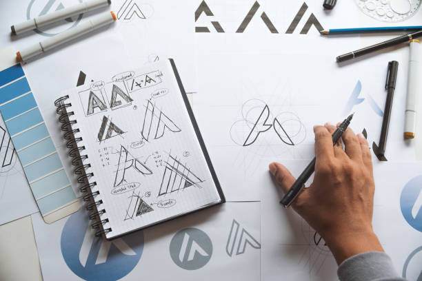 istock Graphic designer creative design sketch drawing logo Trademark brand Workspace 1285785017