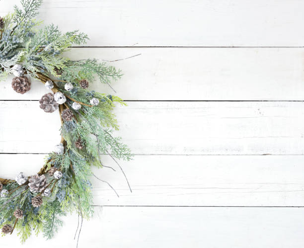Christmas rustic wreath on an old white wood background