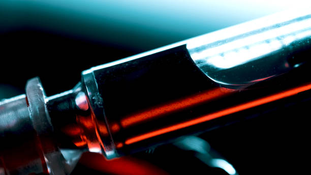 istock A surgical syringe injects the virus. Infected blood. Macro frame 1285785048