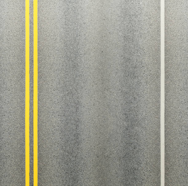 istock Asphalt road and double yellow lines and white side line 1285786105