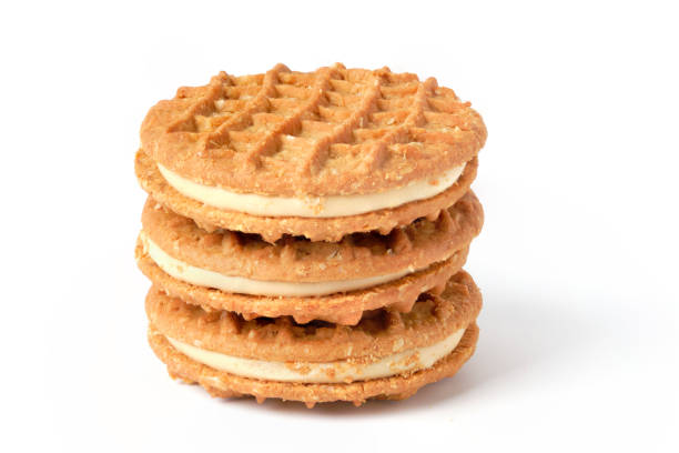 istock Stack of peanut butter cream cookies isolated on white 1285787168