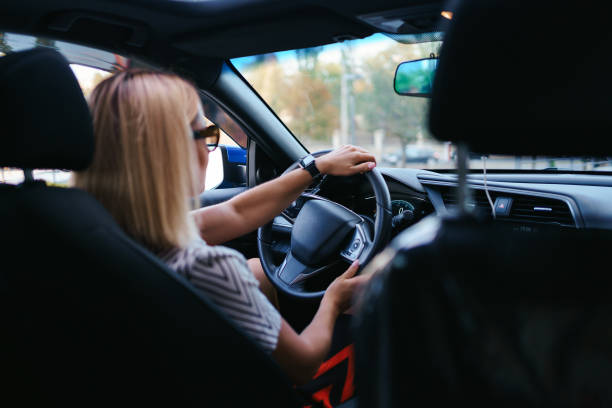 istock Woman in sunglasses driving a car 1285787246