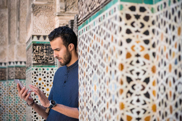 istock Muslim woman using a mobile phone 1285788783