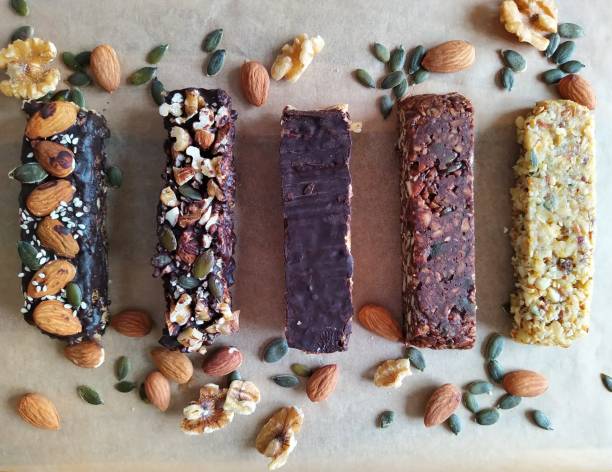 Cereal bar home made Health vegetarian cereal bars with seeds and nuts concession stand stock pictures, royalty-free photos & images
