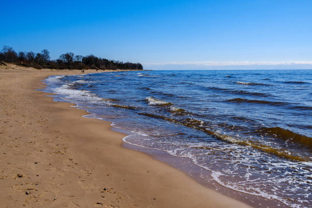 istock sea shore in summer beach with blue water waves and sand 1285795721