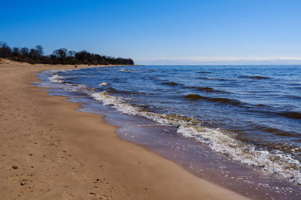 istock sea shore in summer beach with blue water waves and sand 1285795732