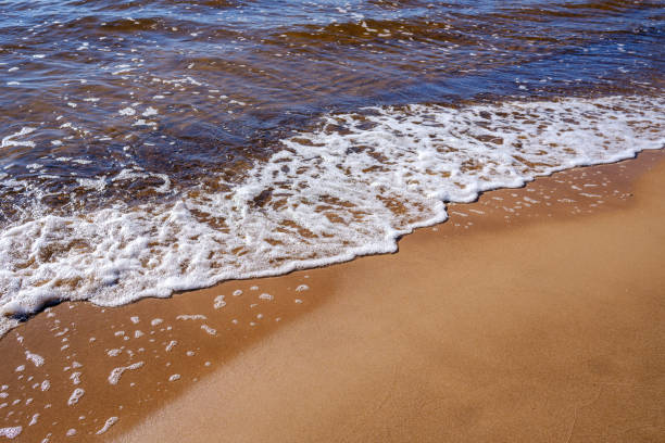 istock sea shore in summer beach with blue water waves and sand 1285795735