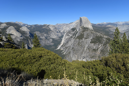 Yosemite Valley and Sierra Nevada Mountains seen from Glacier Point in the Yosemite National Park, California, USA.  Amazing, granite monolith called the Half Dome on the right.