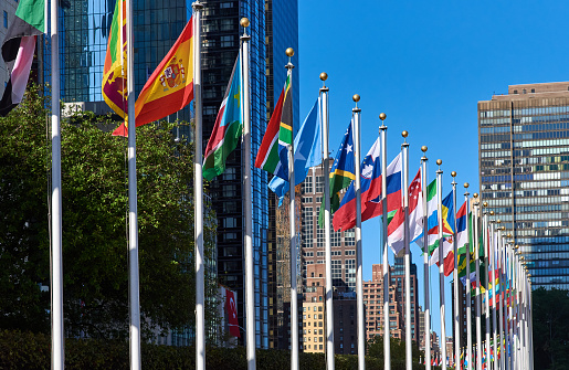 New York, NY - September 22 2020: Flags of the United Nations Member States are displayed in front of the United Nations Headquarters in Midtown Manhattan, New York, NY