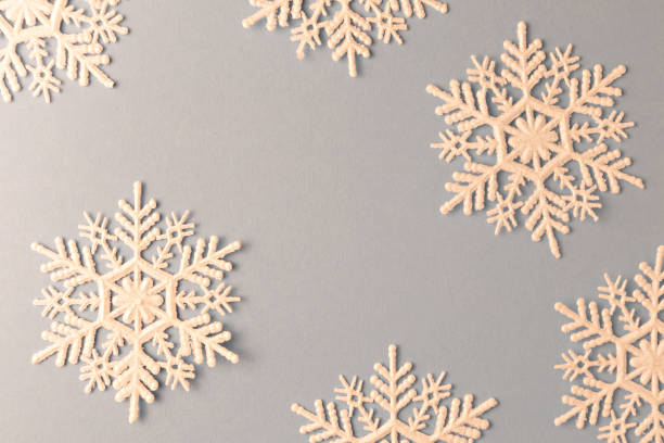 istock Snowflakes for New Year's decor on a blue background with space for text. Christmas layout. 1285800610