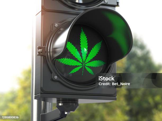 Cannabis Leaf On Green Traffic Light Cannabis And Marijuana Legalization Concept Stock Photo - Download Image Now
